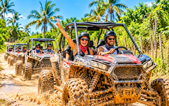 Buggy adventure through tropical landscape in Punta Cana, part of Higüey City Tour.