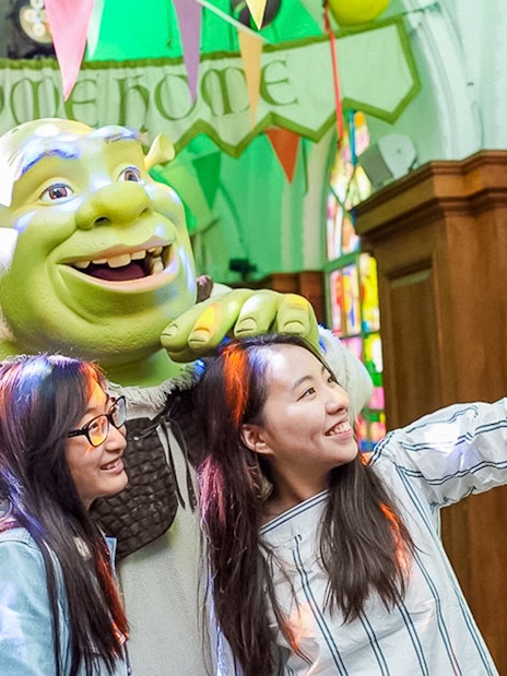 Visitors taking a selfie with Shrek at Shrek's Adventure! London.