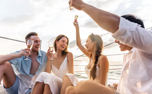 Group enjoying drinks on a boat during a Half Day Athens Cruise.