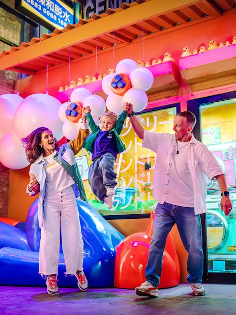 Family enjoying vibrant House of Hype attraction in Dubai.