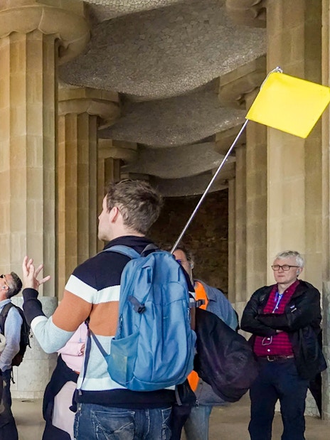 Tour group with guide in the hypostyle hall of Park Güell, Barcelona.