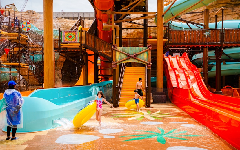 Children playing with inflatable tubes at Aquarabia Water Theme Park, Qiddiya City, Saudi Arabia.