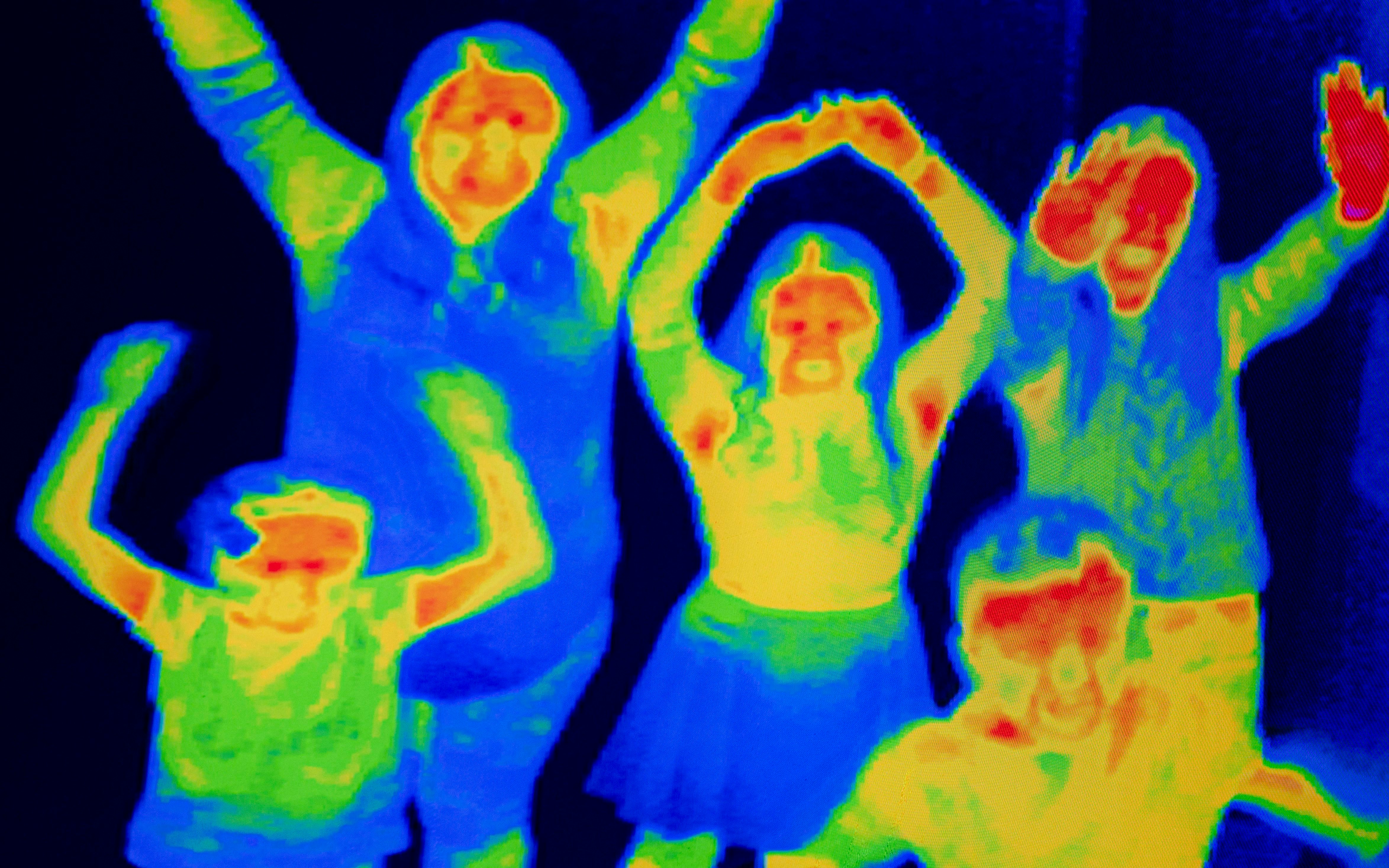 Group of people in thermal camera view at Camera Obscura & World of Illusions, Edinburgh.