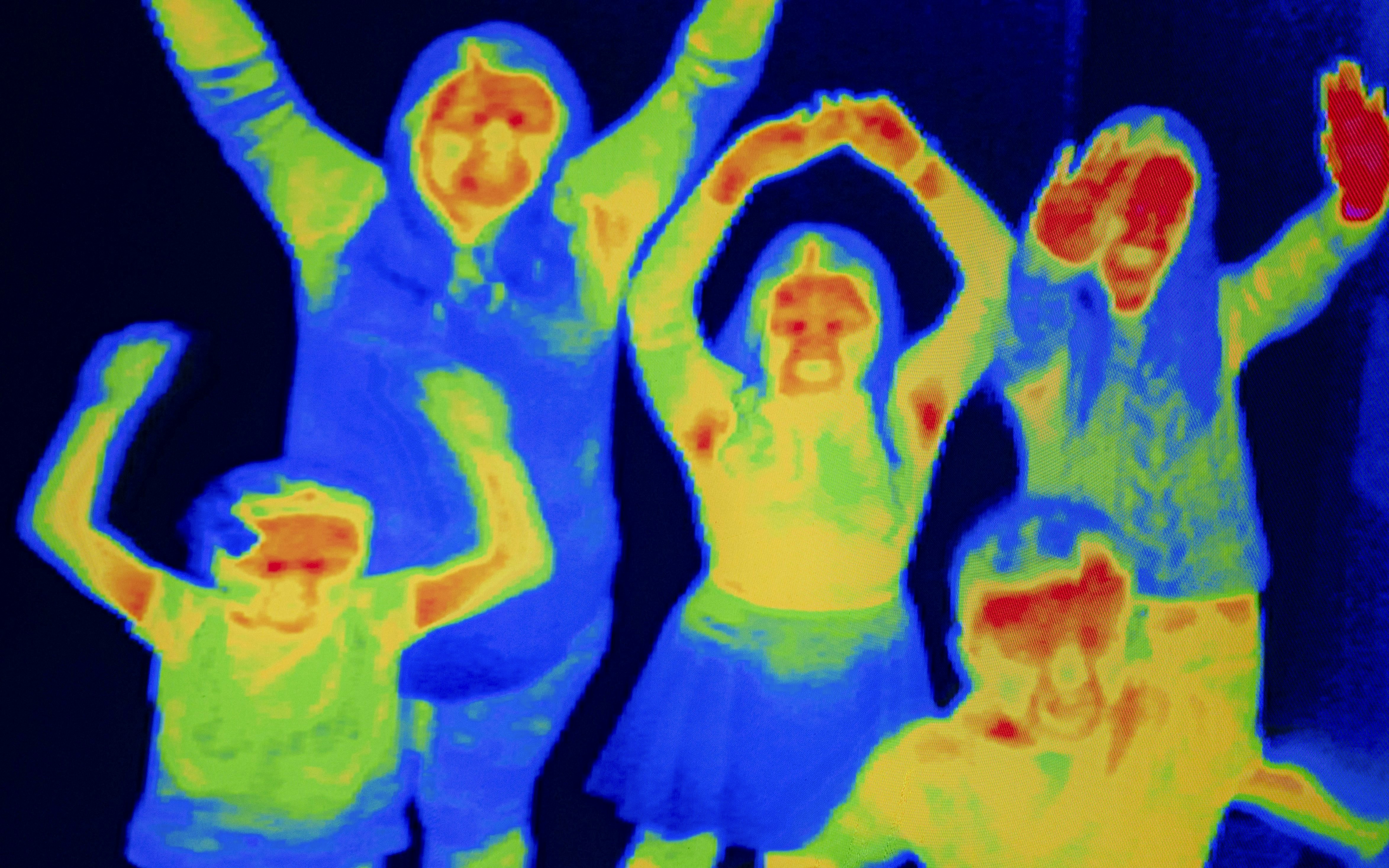 Group of people in thermal camera view at Camera Obscura & World of Illusions, Edinburgh.
