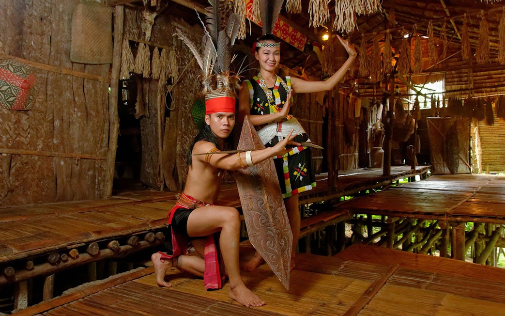 Traditional dancers performing at Mari Mari Cultural Village in Sabah, Malaysia.