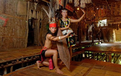 Traditional dancers performing at Mari Mari Cultural Village in Sabah, Malaysia.