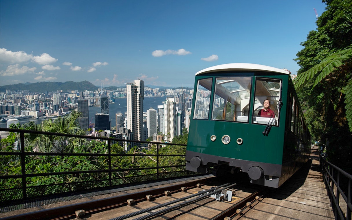 Peak Tram ascending with Hong Kong skyline view, part of Sky Pass experience.