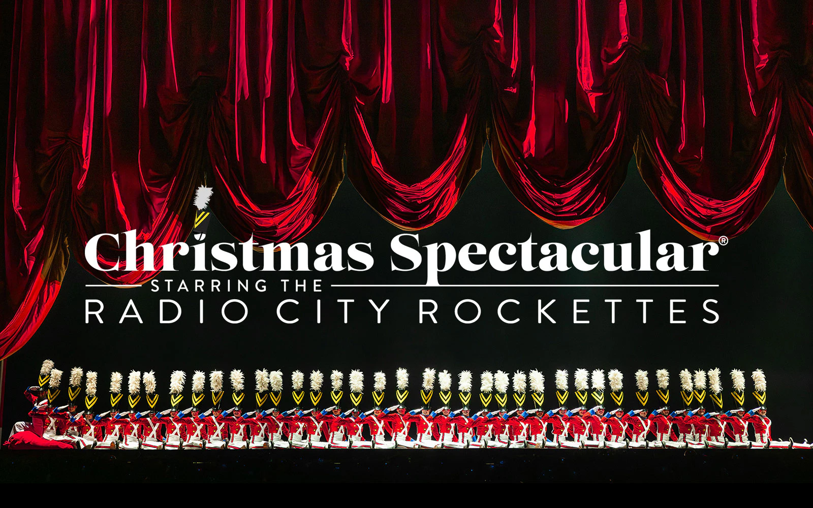 Radio City Rockettes in toy soldier costumes during Christmas Spectacular performance.