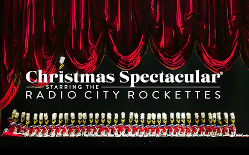 Radio City Rockettes in toy soldier costumes during Christmas Spectacular performance.