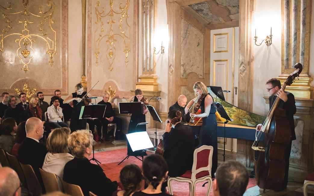 Musicians performing classical music at Mirabell Palace concert hall, Salzburg.
