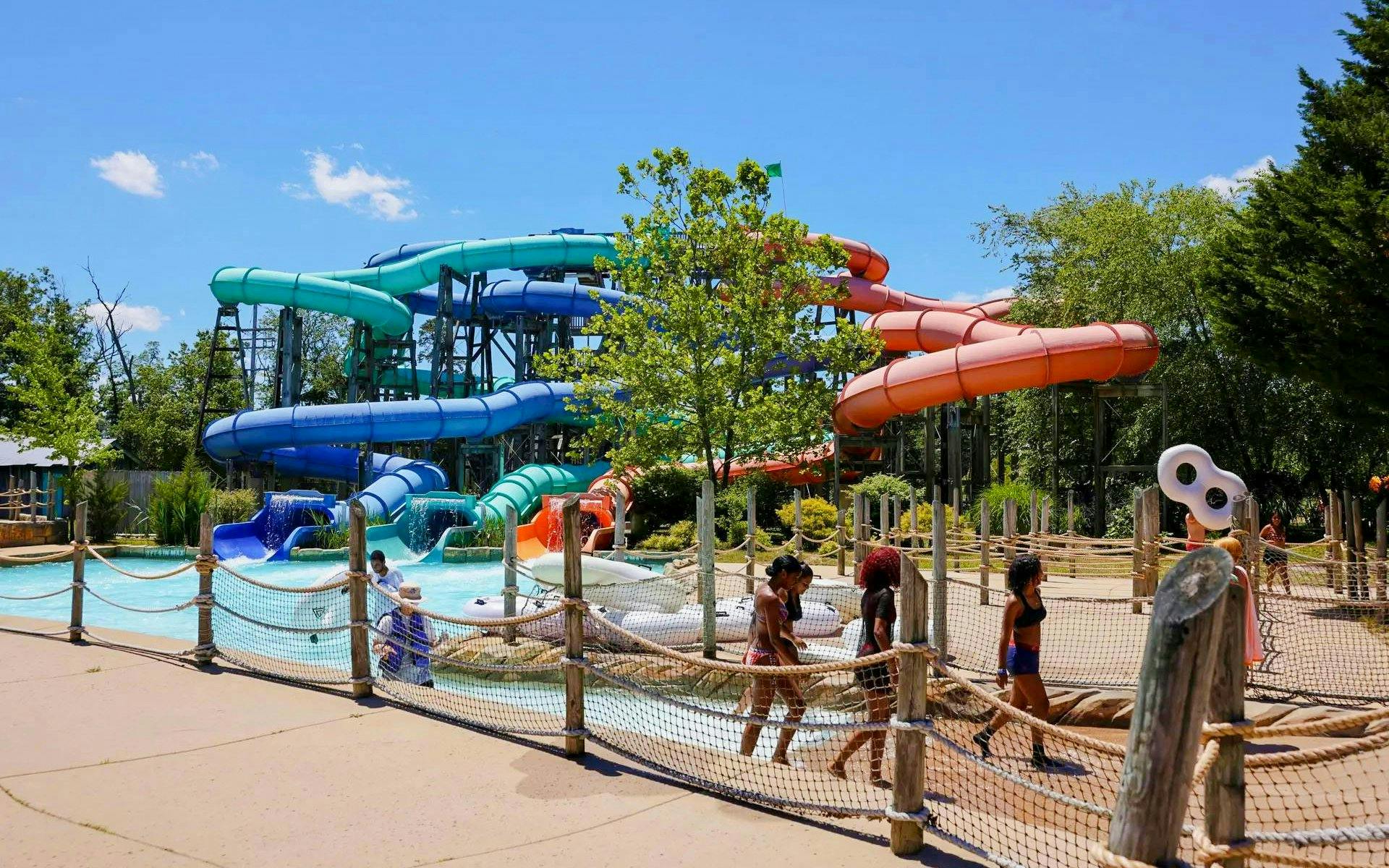 Water slides and visitors at Hurricane Harbor New Jersey water park.