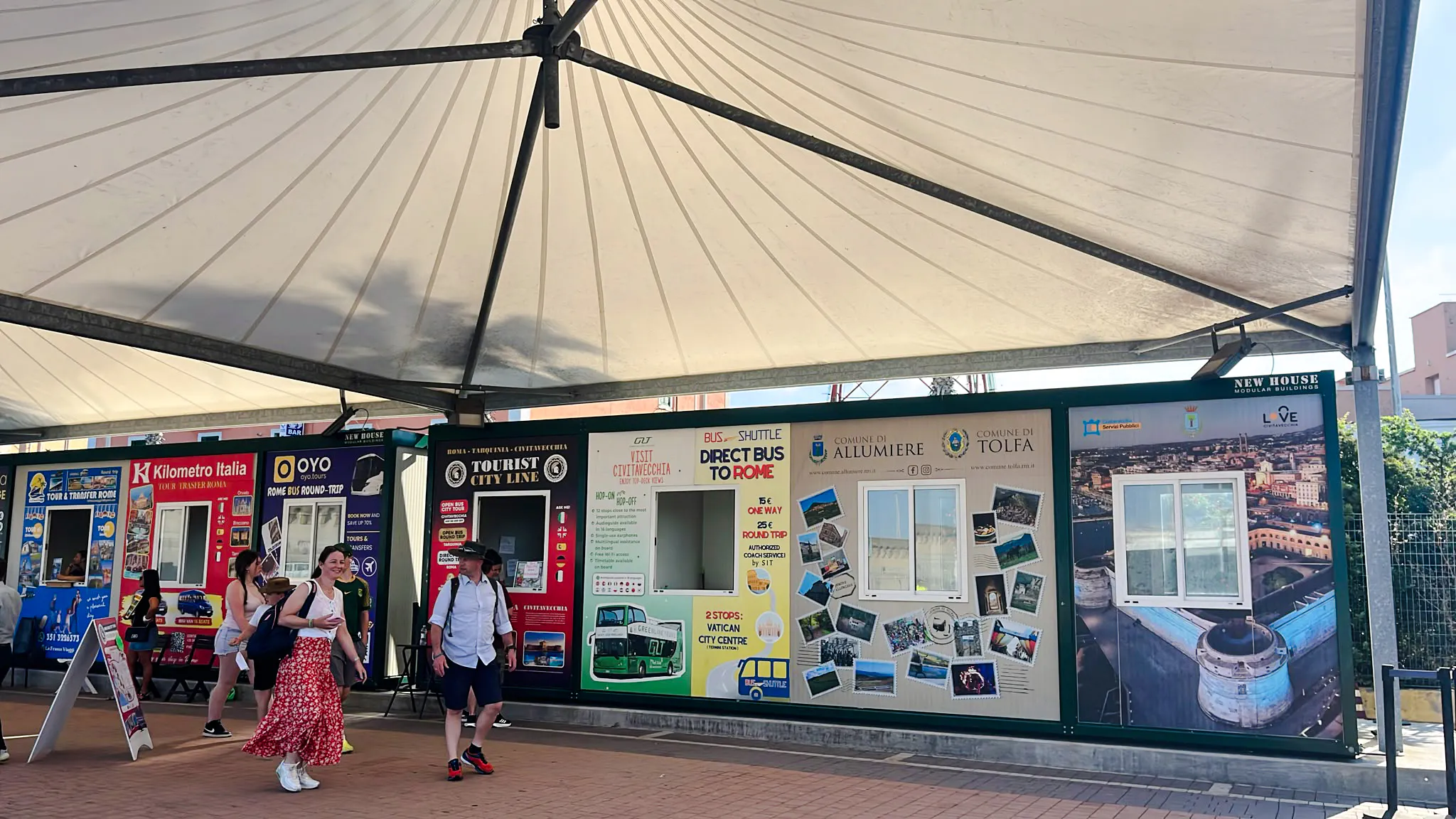 Shuttle service kiosks at Civitavecchia Port for transfers to Fiumicino Airport, Rome.