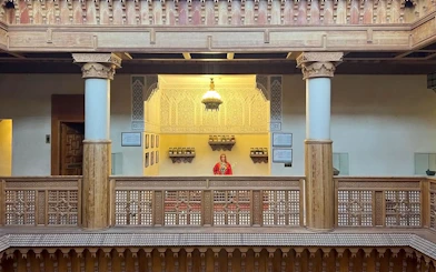 Interior view of Moroccan Culinary Arts Museum with intricate woodwork and traditional decor.