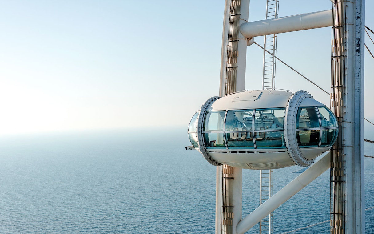 Ain Dubai pod overlooking the sea.