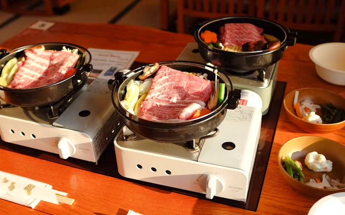Beef hot pot on table at Yakatabune Hot Pot Cruise, Japan.