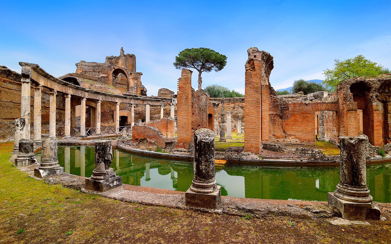 Hadrian's Villa ruins with columns and reflecting pool in Tivoli, Italy.