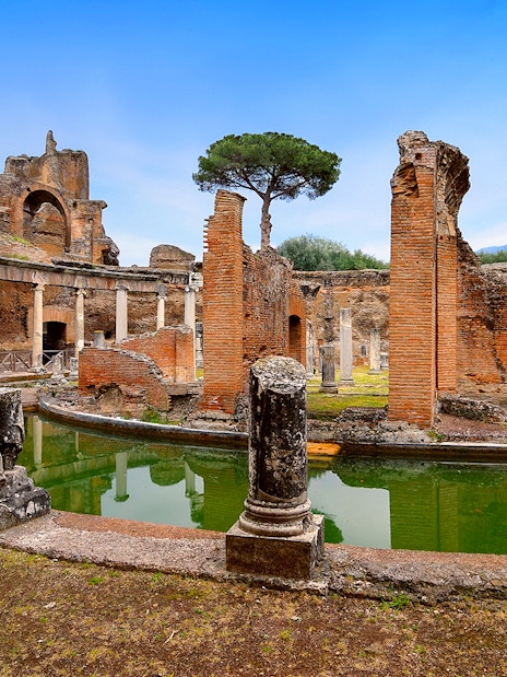 Hadrian's Villa ruins with columns and reflecting pool in Tivoli, Italy.
