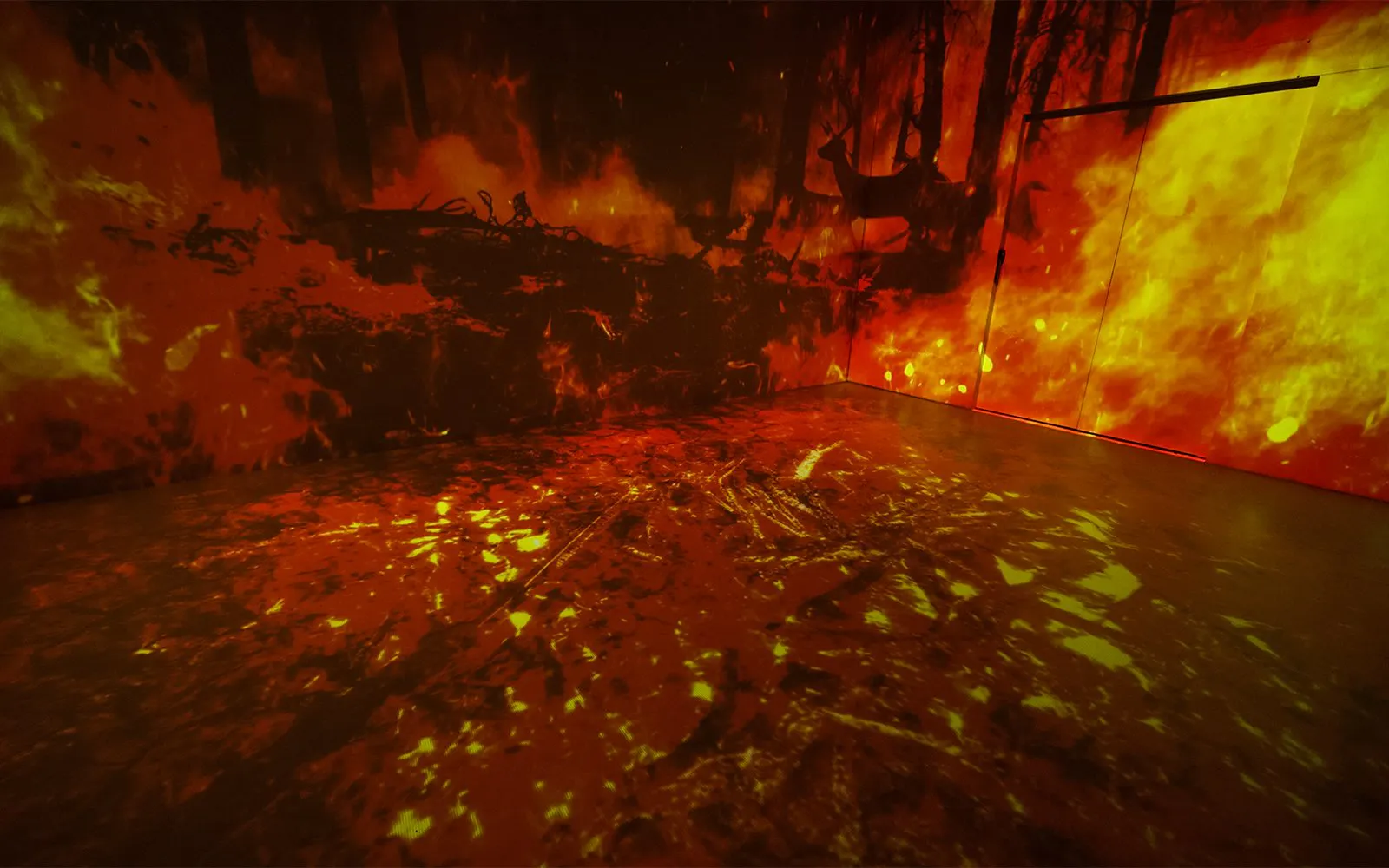 Immersive art installation depicting a forest fire, highlighting environmental themes.