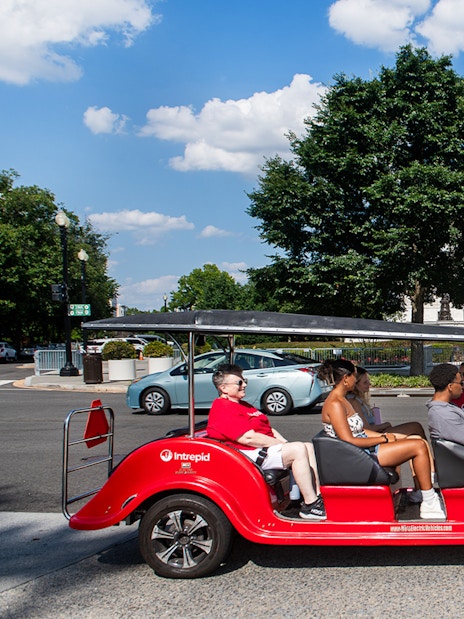 Electric cart tour passing the Supreme Court building in Washington DC.