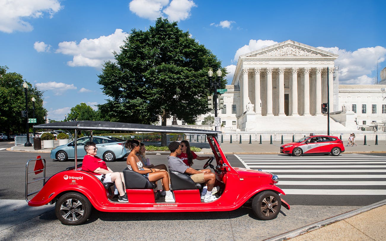 Electric cart tour passing the Supreme Court building in Washington DC.