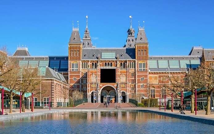 Rijksmuseum facade with visitors, Amsterdam, part of Skip The Line Combo tour.