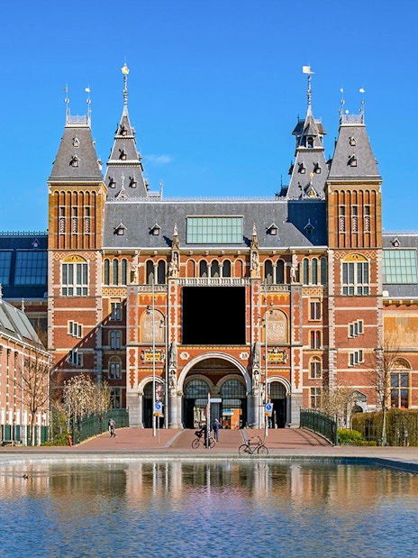 Rijksmuseum facade with visitors, Amsterdam, part of Skip The Line Combo tour.