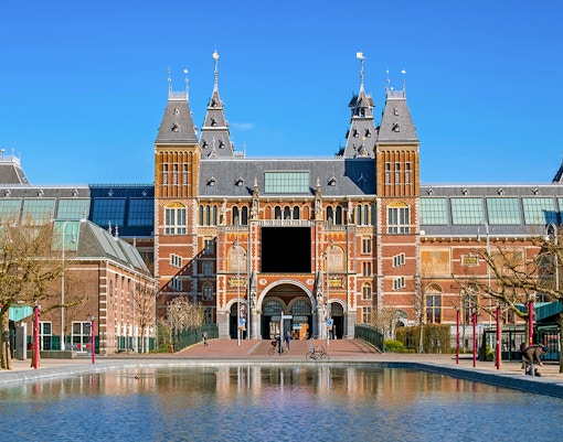 Rijksmuseum facade with visitors, Amsterdam, part of Skip The Line Combo tour.