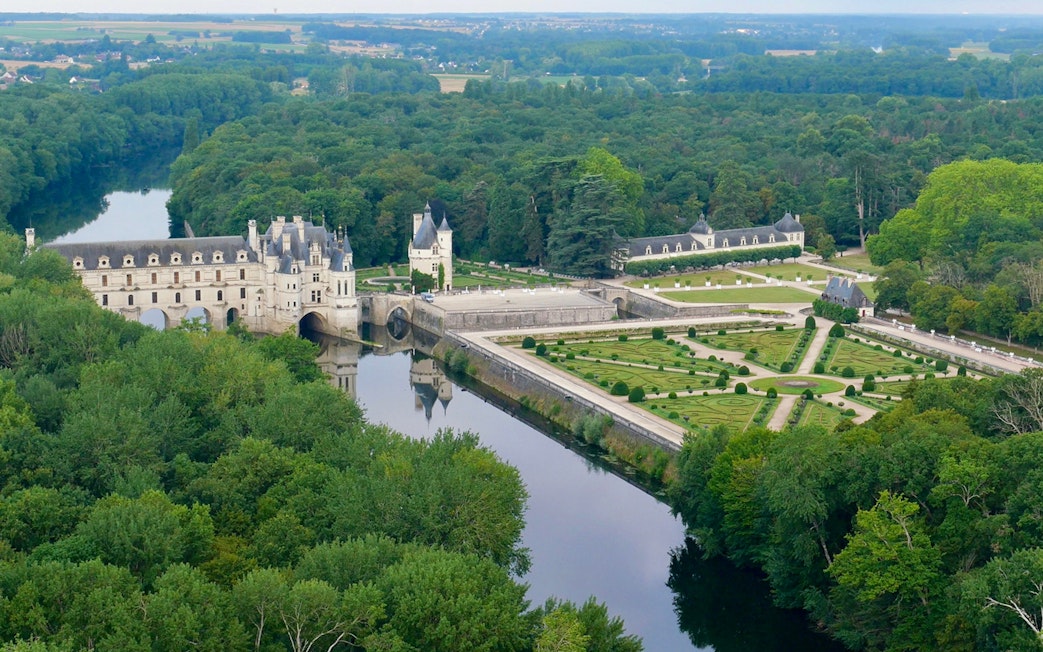 Chenonceau Castle with gardens and river view, Loire Valley, France.