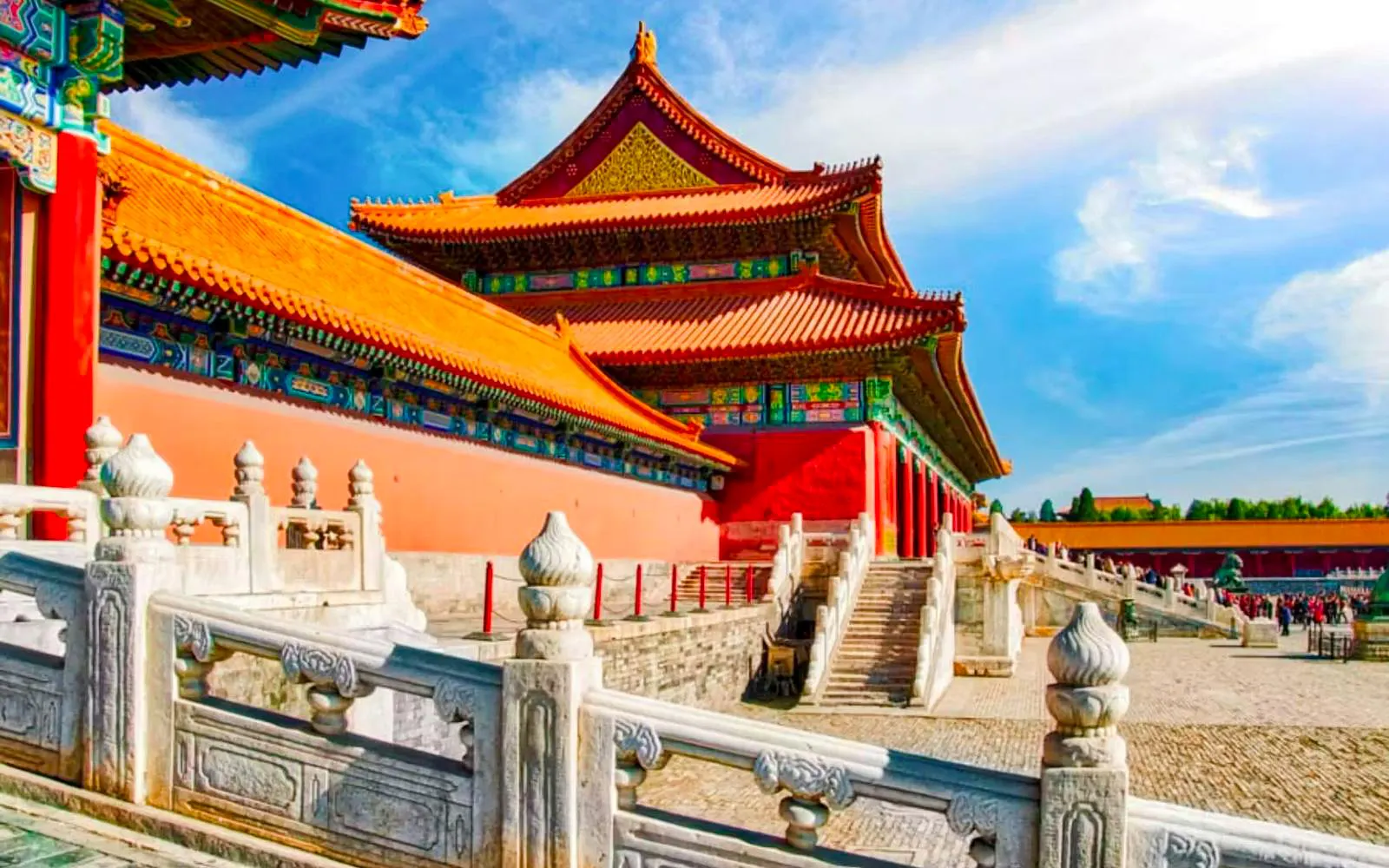 Palace Museum in Beijing with red walls, yellow-tiled roofs, and white marble balustrade.