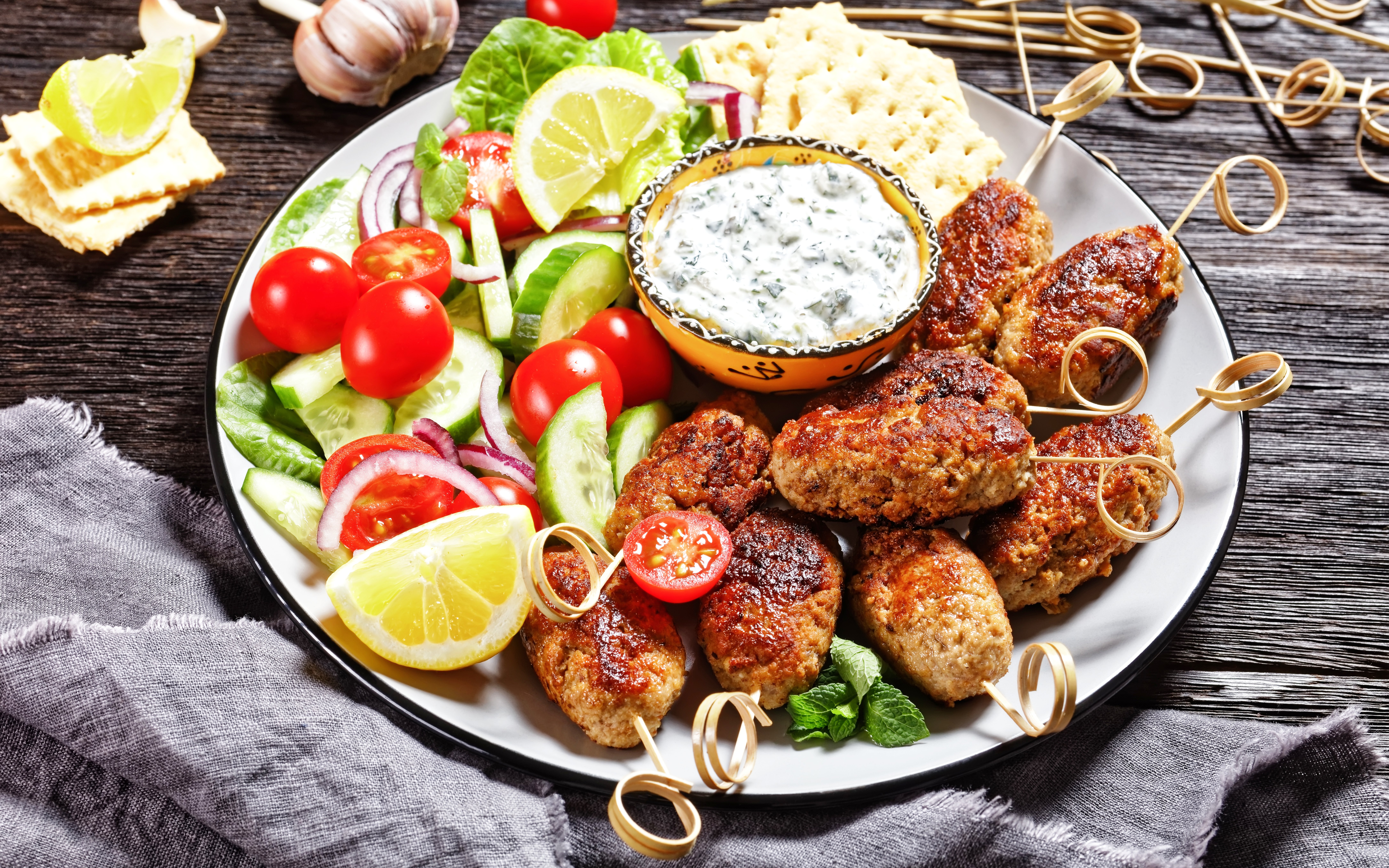Lamb kleftiko skewers with salad and tzatziki at a Delphi restaurant.