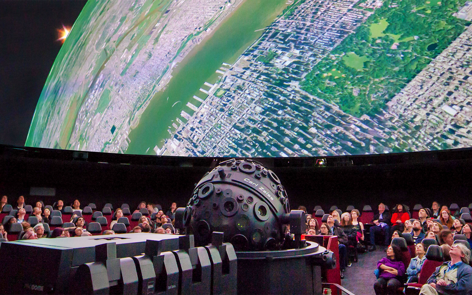 Visitors at the American Museum of Natural History viewing the Milky Way exhibit via Zeiss projector.
