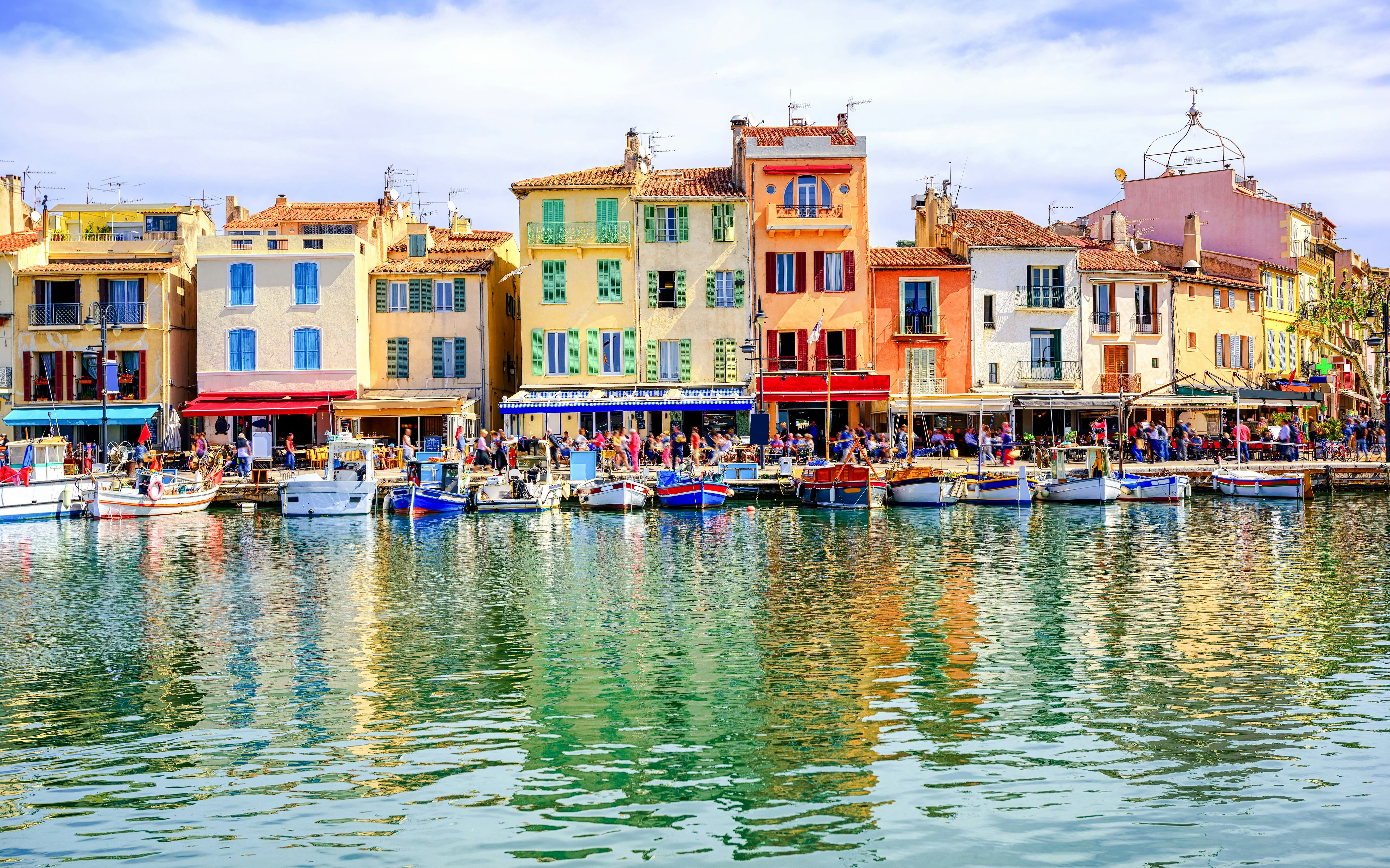 Colorful waterfront buildings and boats in Cassis, Provence.