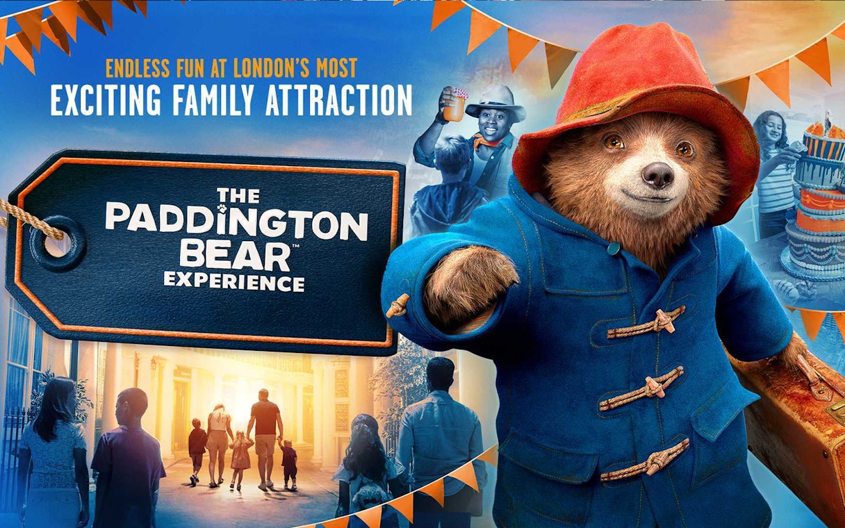 Paddington Bear statue at Paddington Station, London, promoting The Paddington Bear Experience.