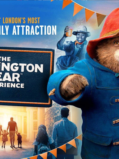 Paddington Bear statue at Paddington Station, London, promoting The Paddington Bear Experience.