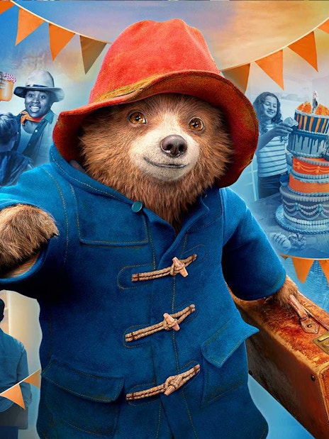 Paddington Bear statue at Paddington Station, London, promoting The Paddington Bear Experience.