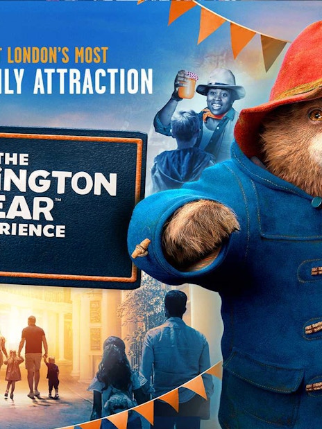 Paddington Bear statue at Paddington Station, London, promoting The Paddington Bear Experience.