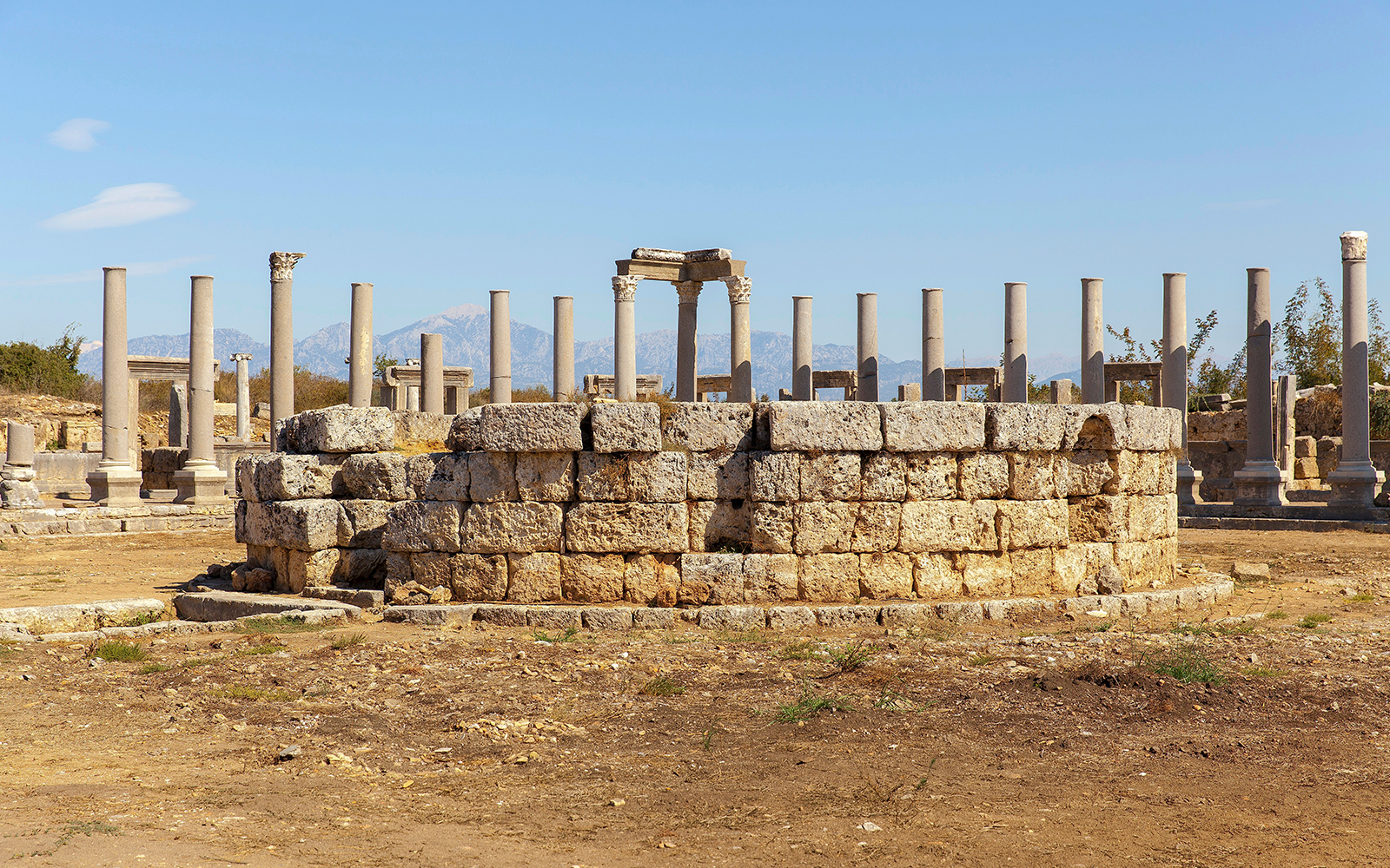 Ancient agora ruins in the Greek city of Neapolis with stone columns and pathways.