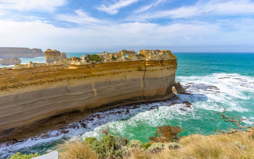 Razorback rock formation along the Great Ocean Road with ocean waves below.