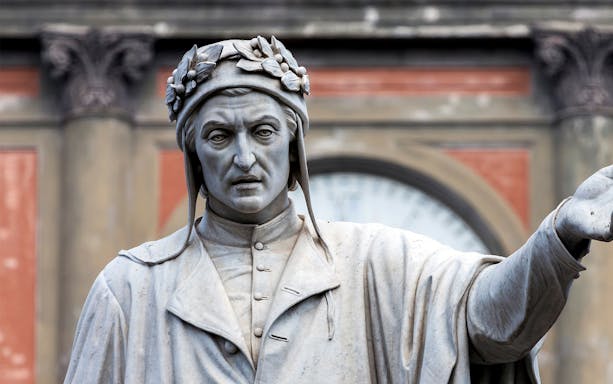 Statue of a historical figure in the Decumani district, Naples.