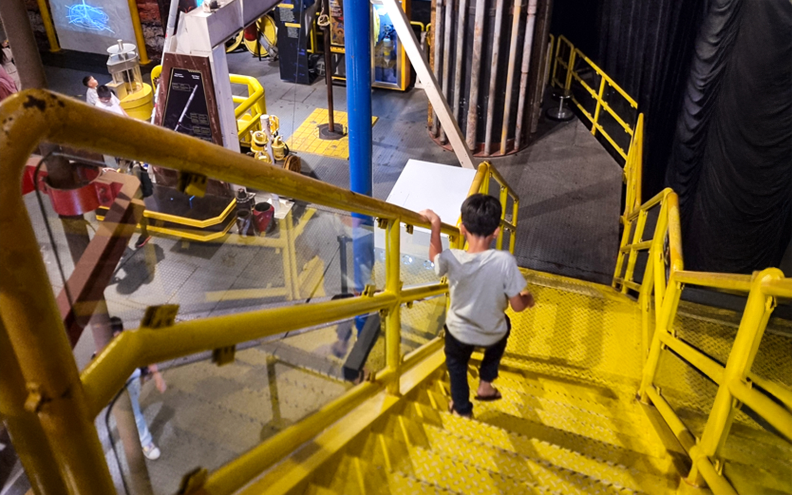Child exploring interactive exhibit at Petrosains, The Discovery Centre in Kuala Lumpur.