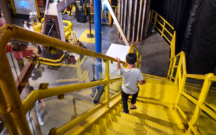 Child exploring interactive exhibit at Petrosains, The Discovery Centre in Kuala Lumpur.