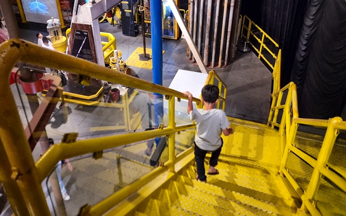 Child exploring interactive exhibit at Petrosains, The Discovery Centre in Kuala Lumpur.