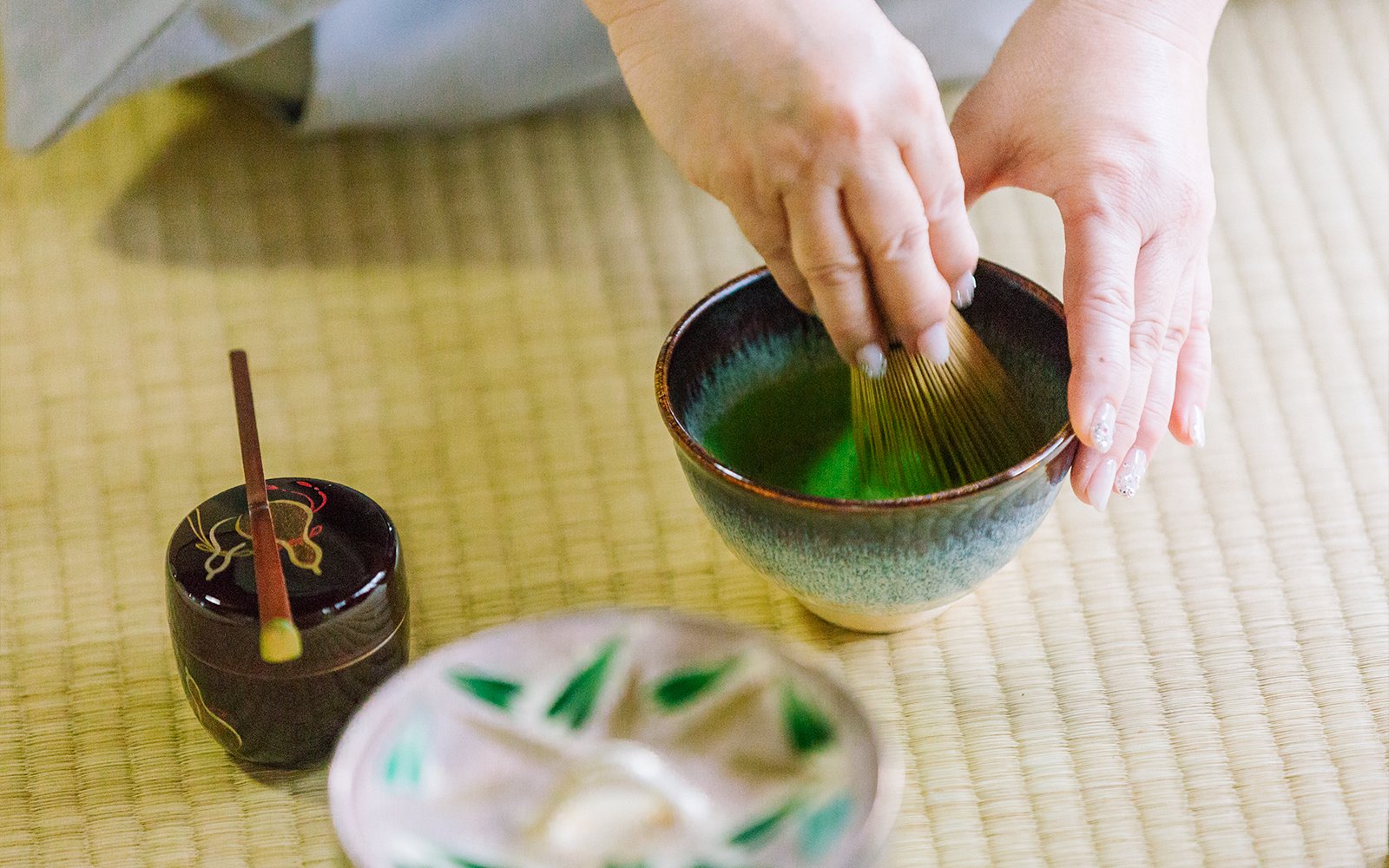Whisking matcha in a traditional tea ceremony at a 100-year-old Machiya townhouse.