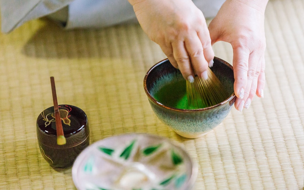 Whisking matcha in a traditional tea ceremony at a 100-year-old Machiya townhouse.