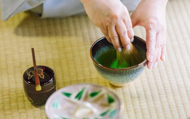 Whisking matcha in a traditional tea ceremony at a 100-year-old Machiya townhouse.