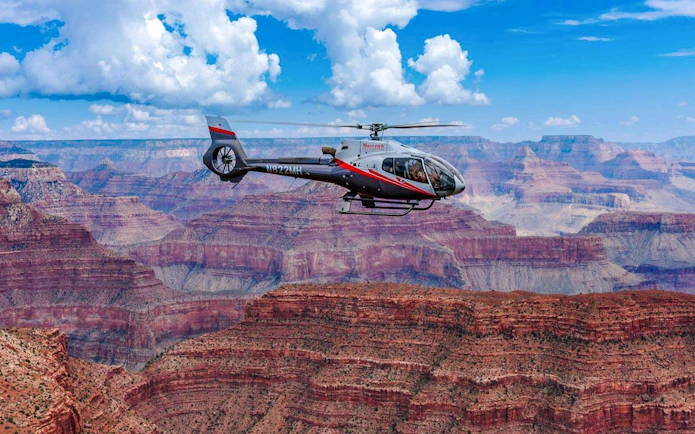 Helicopter flying over the Grand Canyon South Rim.