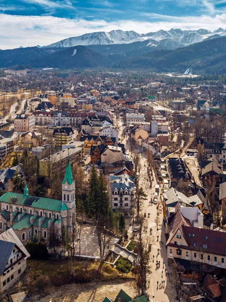 Aerial view of Zakopane with Tatra Mountains in the background, near Morskie Oko.