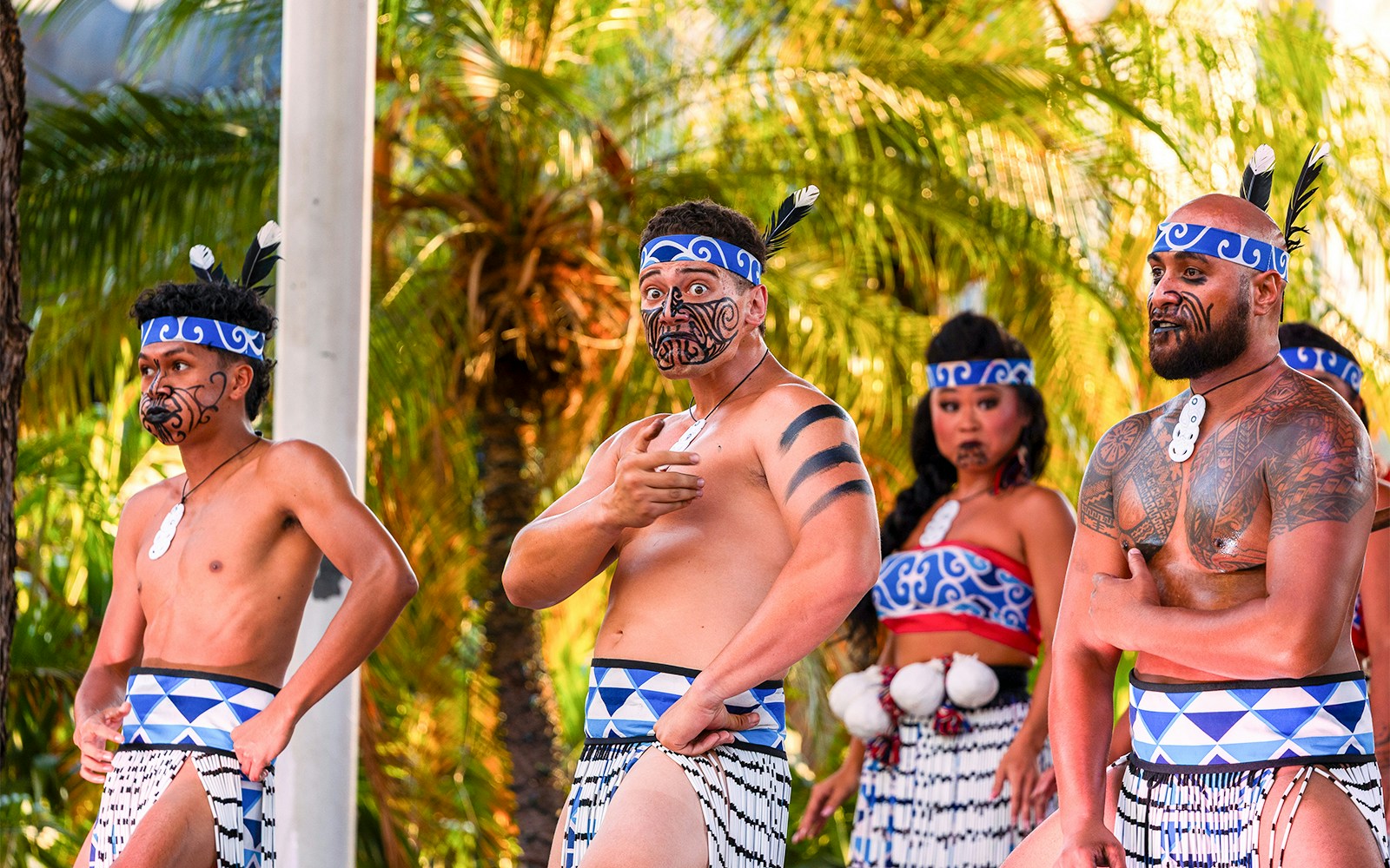 Performers in traditional attire at Moana Luau, Hawaii.