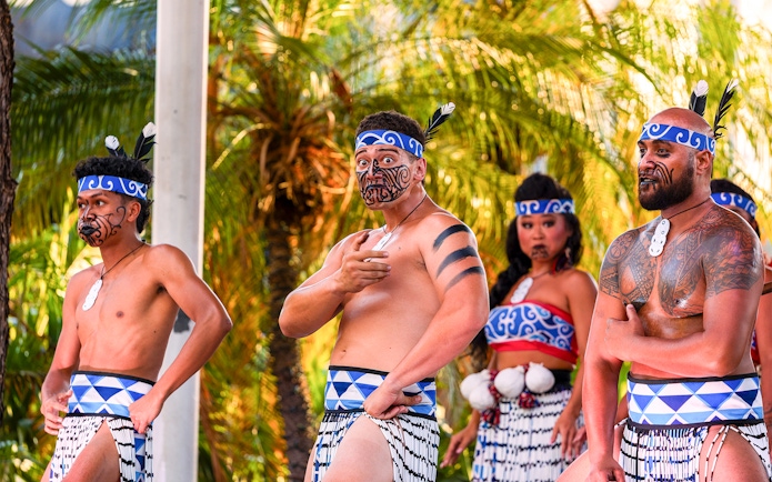Performers in traditional attire at Moana Luau, Hawaii.