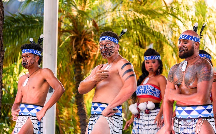 Performers in traditional attire at Moana Luau, Hawaii.